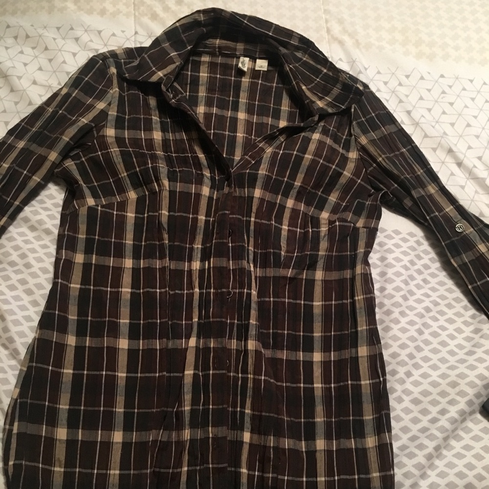 Brown collared button up shirt.